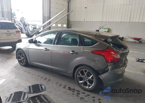 2014 Ford Focus Titanium z USA, uszkodzony, nr VIN 1FADP3N23EL317257